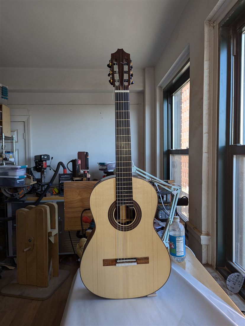 Handbuilt classical guitar with natural spruce top and rosette detail by Paul McEvoy Guitars.