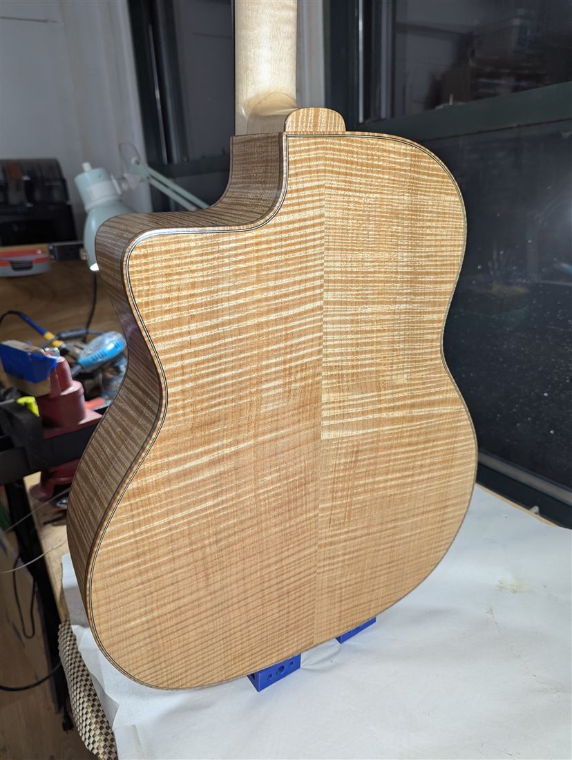 Back of the Jimmy guitar showing flamed wood grain.