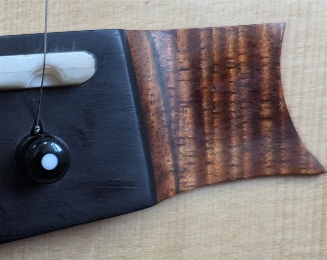 Rear headstock detail of the Maple Steel guitar.