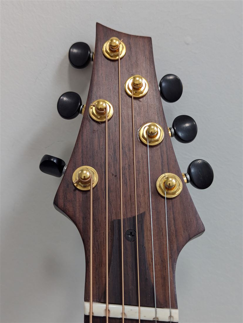 Front headstock detail of the Maple Steel guitar.