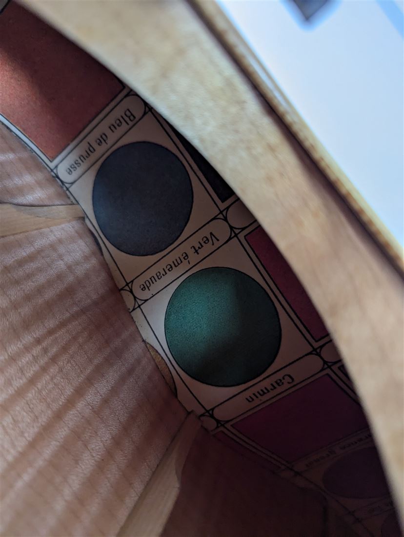 Wood and finish reference swatches used for the Maple Steel build.