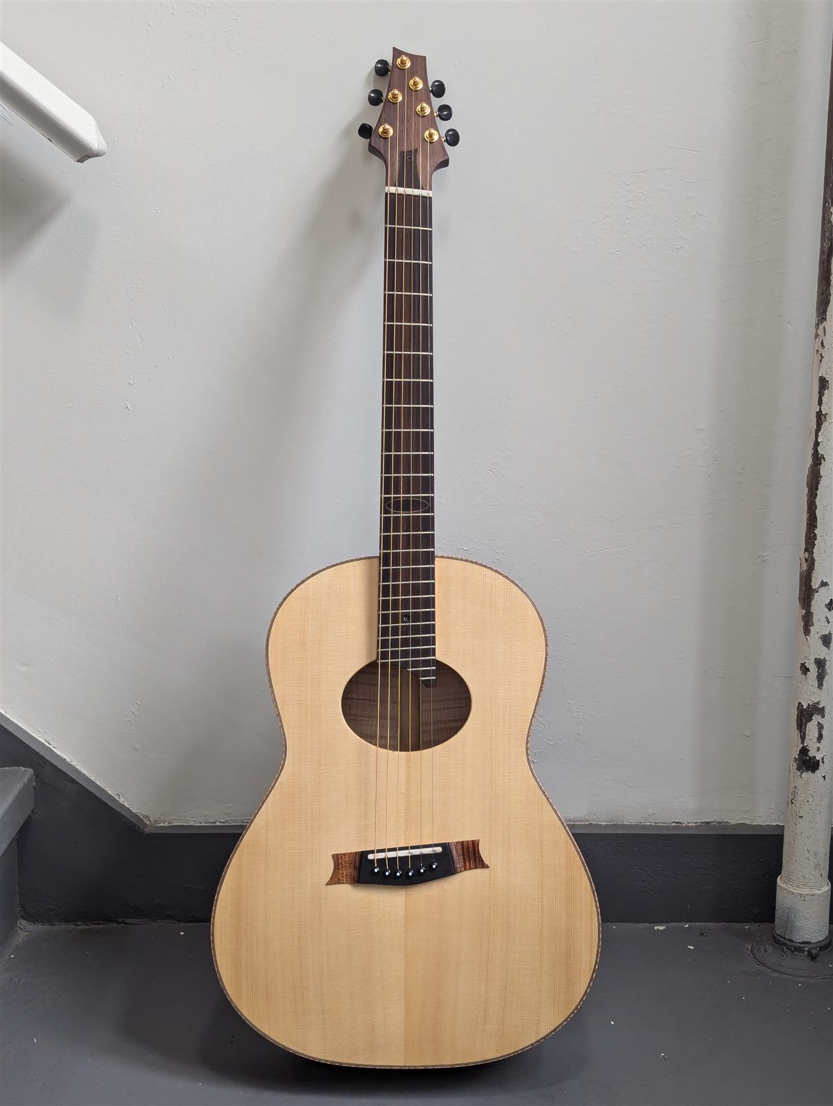 Handbuilt steel-string parlor guitar with maple back and sides by Paul McEvoy Guitars.