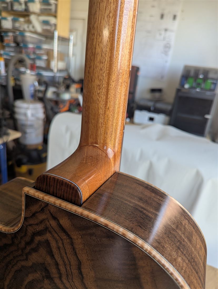 Full back view of the New Walnut guitar in the studio stairwell.