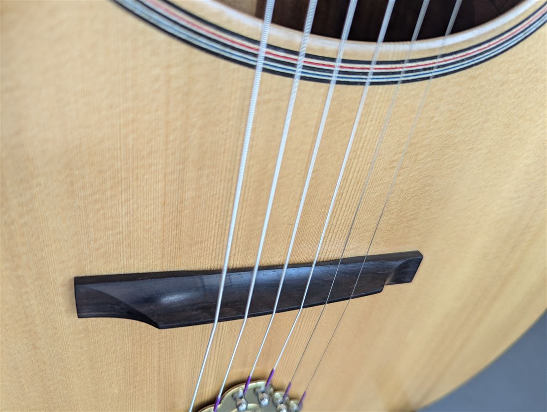 Bridge detail of the Old Walnut guitar.