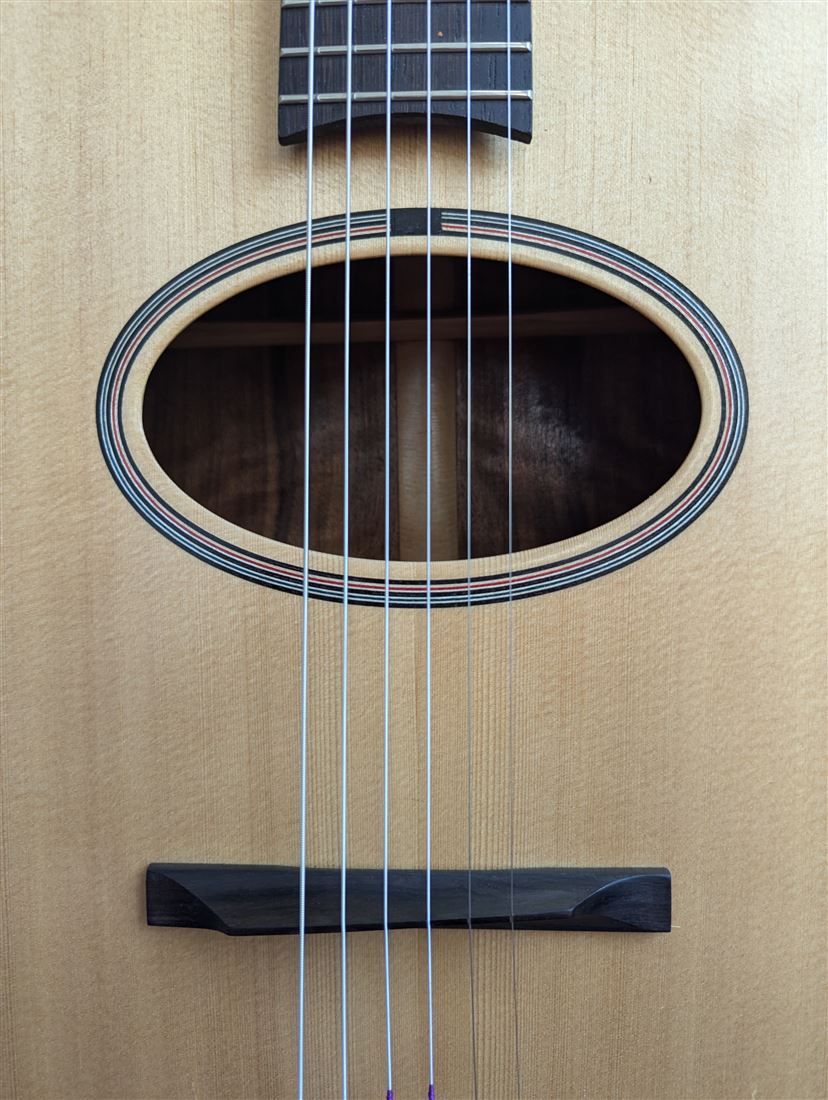 Front headstock detail of the Old Walnut guitar.