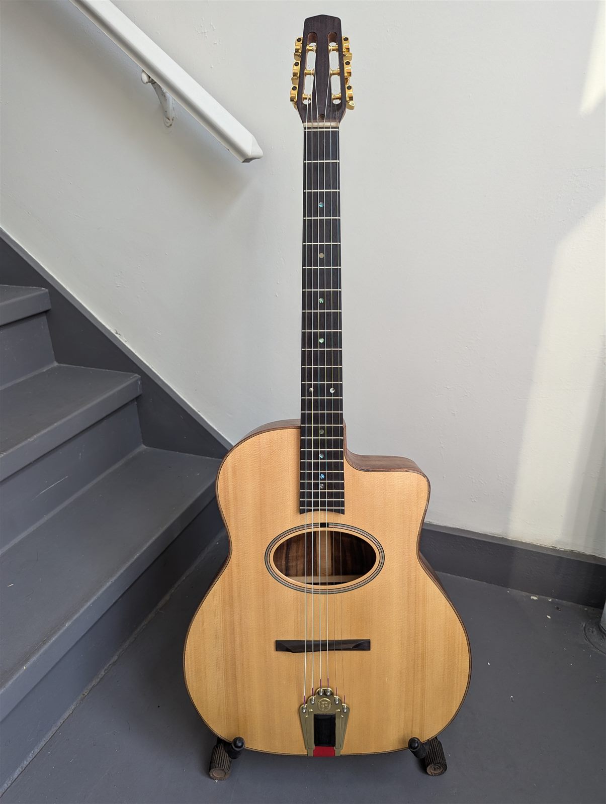 Handbuilt acoustic guitar with natural spruce top by Paul McEvoy Guitars.