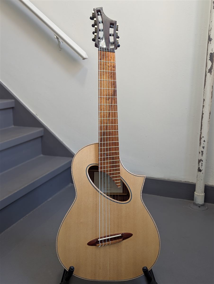Full-body view of the handbuilt 7-string multiscale nylon-string guitar by Paul McEvoy Guitars.
