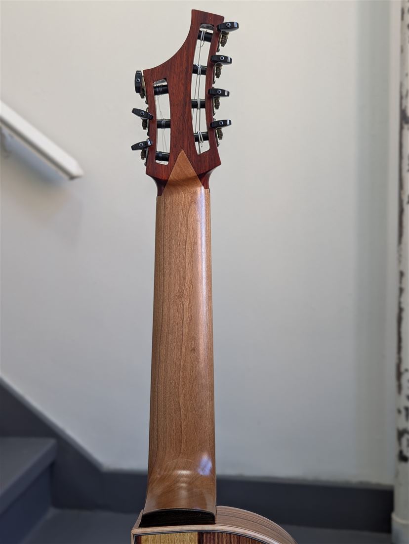 Rear view of the 7-string guitar's headstock and tuning machines.