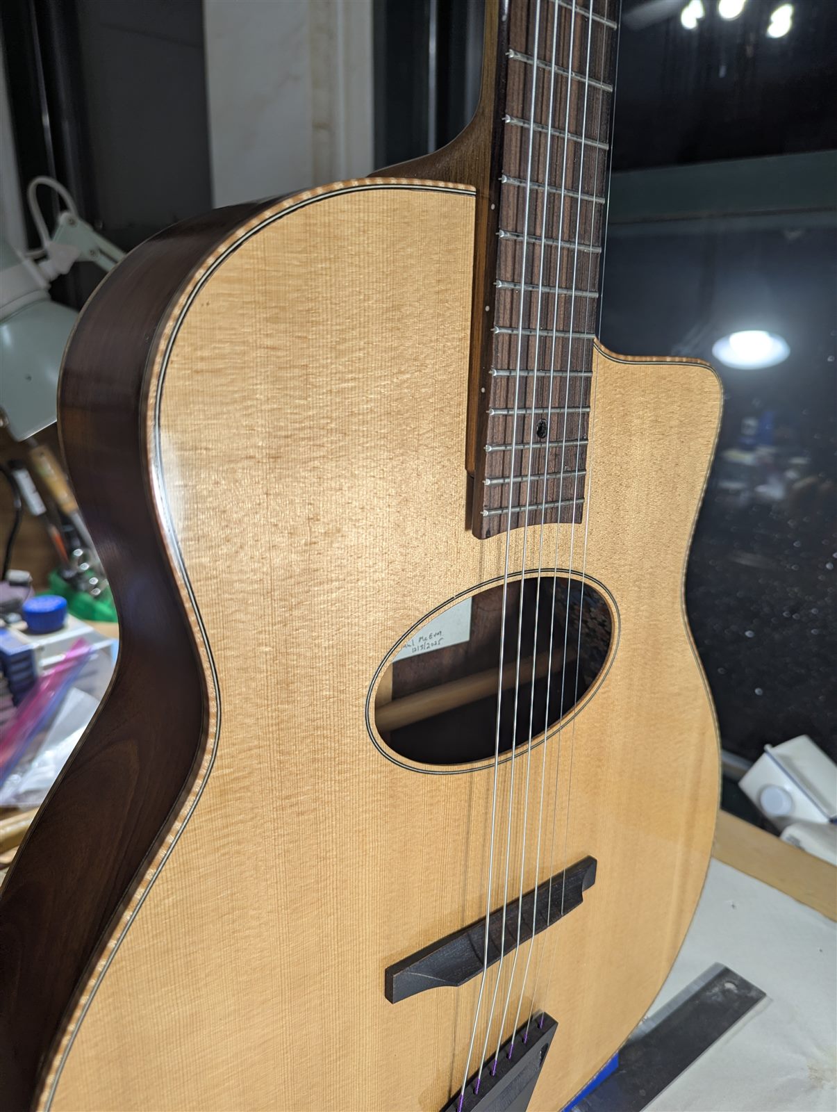 Handbuilt acoustic guitar with walnut sides and mahogany neck by Paul McEvoy Guitars.