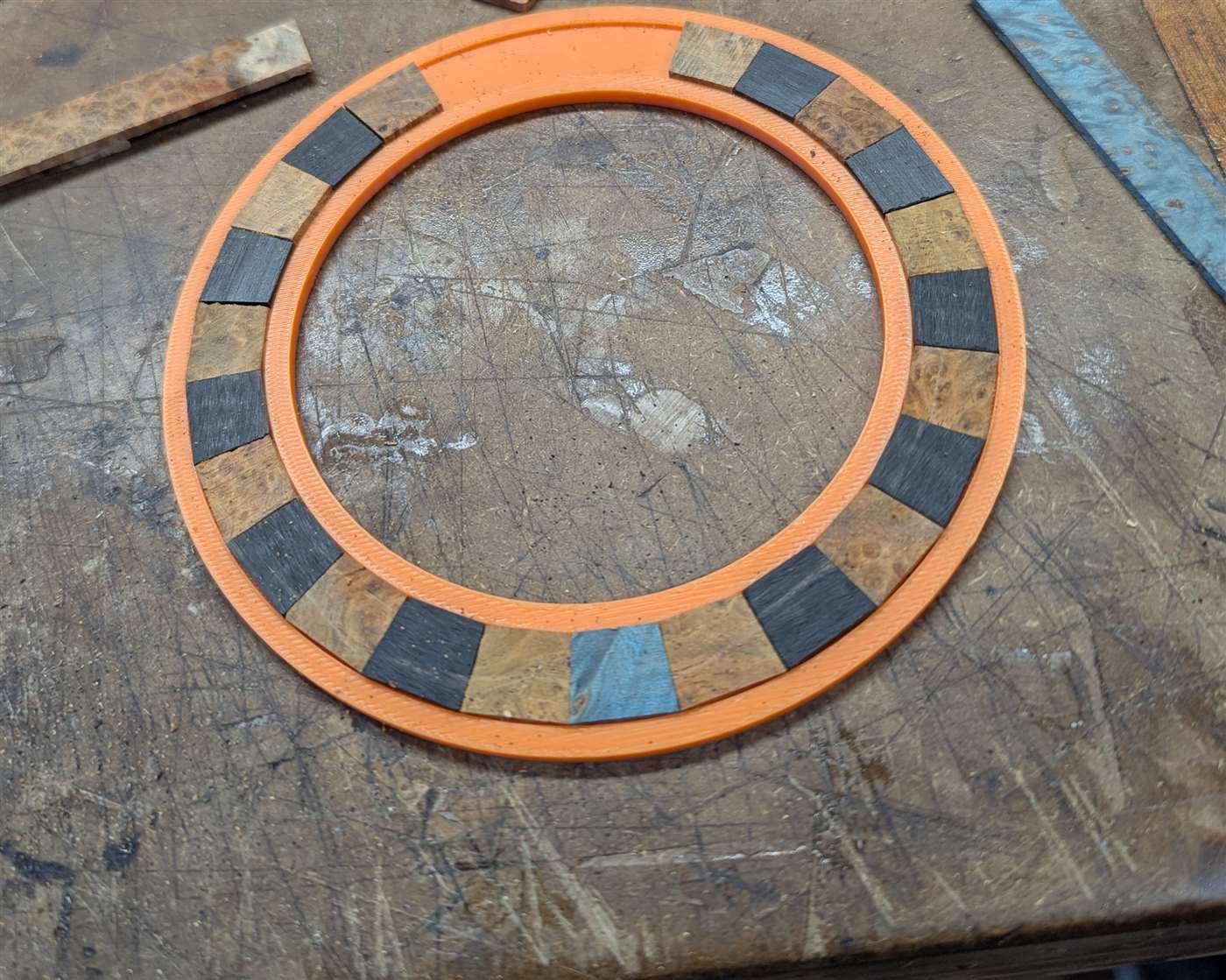 A 3d printed ring used for laying out a mosaic rosette.