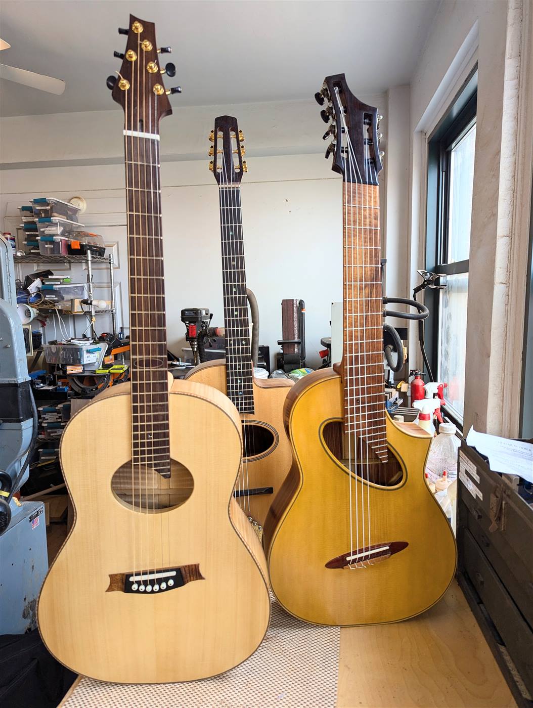 Three guitars finished and ready to be played.