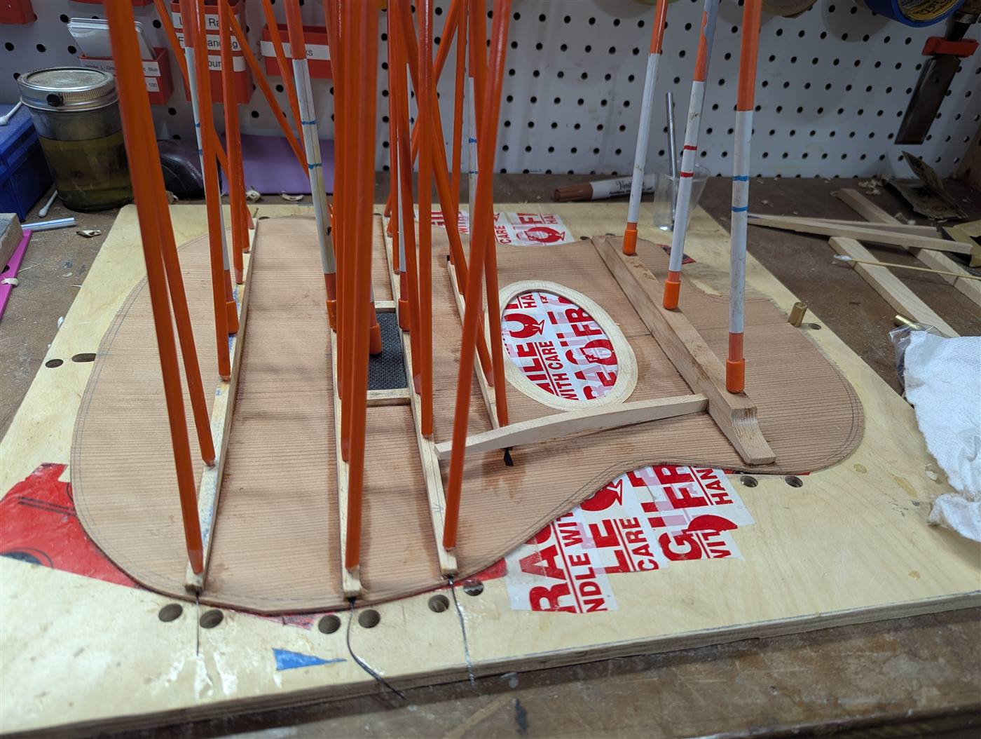 Bracing a Selmer style guitar with a carbon fiber bridge plate.