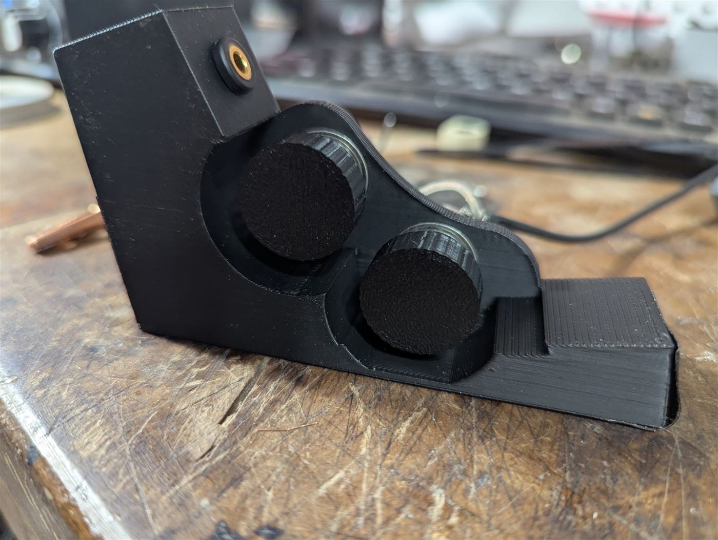 A 3d printed volume and tone control for an acoustic guitar.